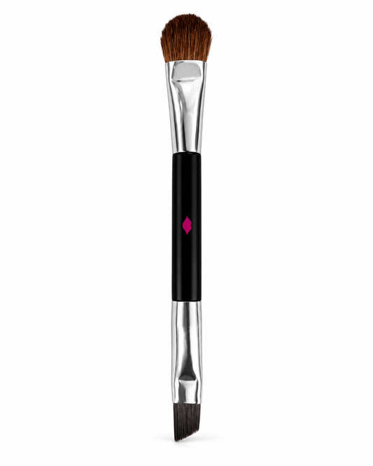 Reverse of Laura Geller double-ended travel brush with pink handle detail and silver-tone fittings